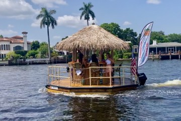 a tiki boat in a body of water